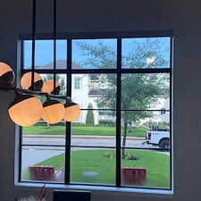 Contemporary-Norman-Motorized-Room-Darkening-Roller-Shades-Over-Entry-Window-on-Briarmead-Dr-in-Houston-TX 1