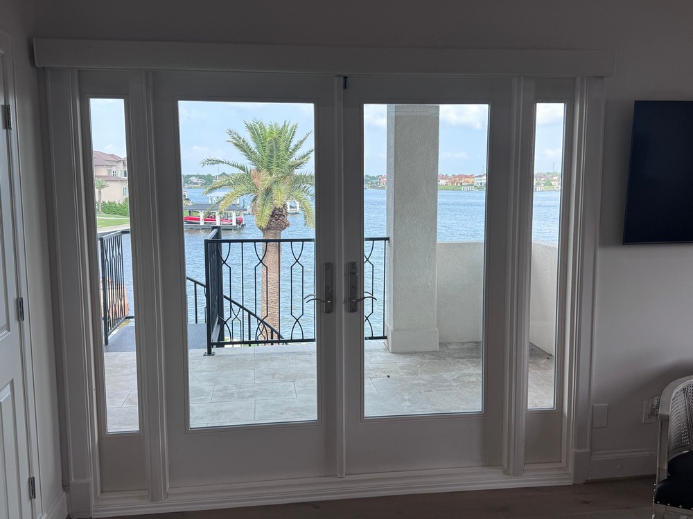 Durable Room Darkening Roller Shade over Patio Doors on Coral Way Ct in Seabrook, TX