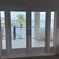 Durable-Room-Darkening-Roller-Shade-over-Patio-Doors-on-Coral-Way-Ct-in-Seabrook-TX 0