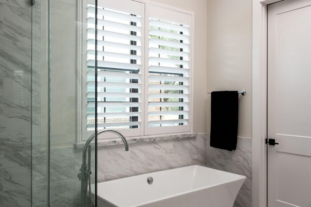 Innovative 3 1/2-Inch Norman Woodlore Shutters with Hidden Tilt on N Carlsbad Ln in Deer Park, TX