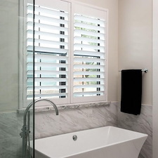Innovative-3-1-2-Norman-Woodlore-Shutters-with-Hidden-Tilt-on-N-Carlsbad-Ln-in-Deer-Park-TX 0